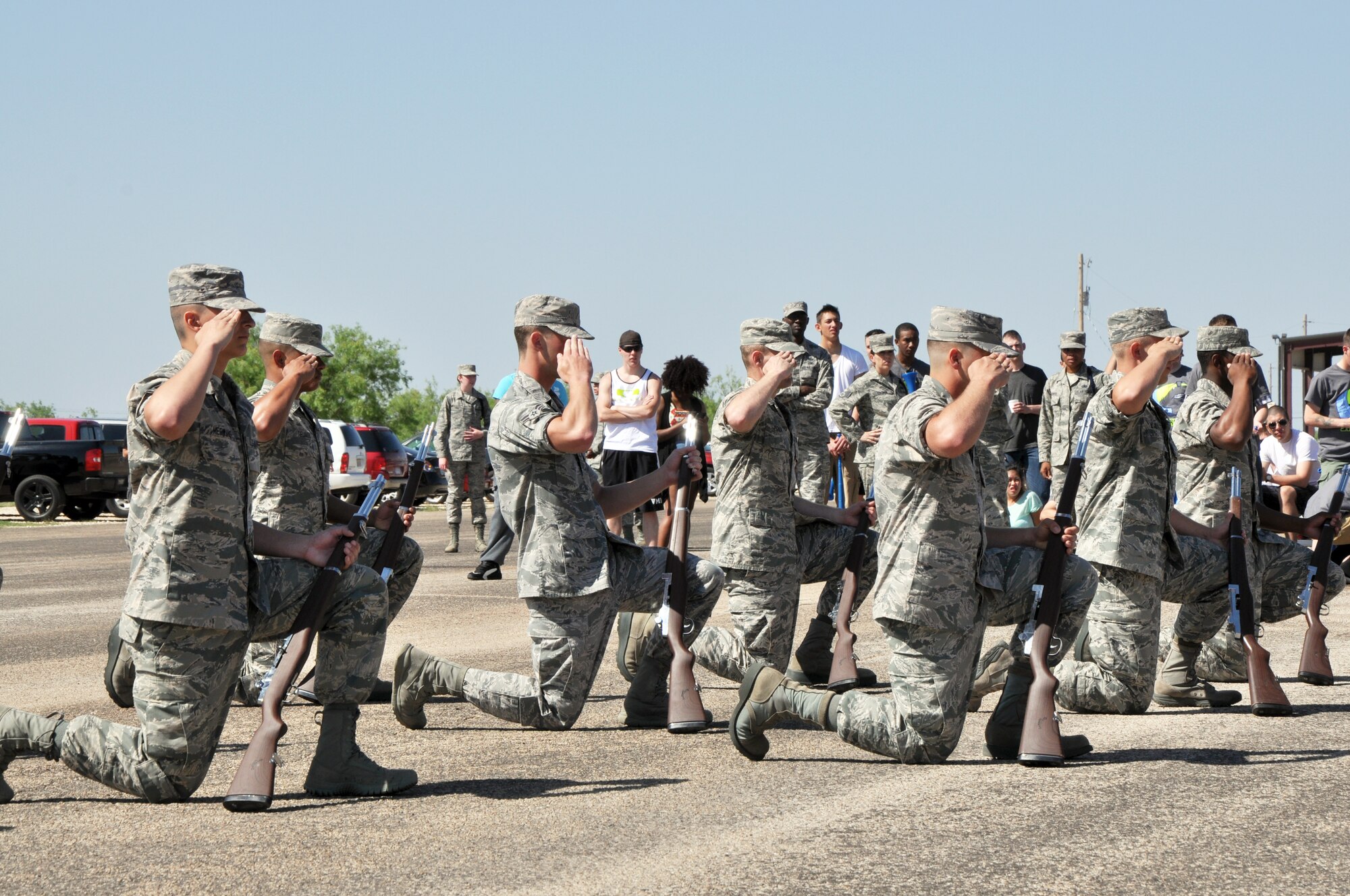 GOODFELLOW AIR FORCE BASE, Texas – The 312th Training Squadron performs a modified salute before starting the exhibition drill portion of the 17th Training Group’s second quarter drill competition on the flight line here May 10. The 312th TRS was the only team to compete in the exhibition drill portion with rifles. (U.S. Air Force photo/ Senior Airman Joshua Edwards)