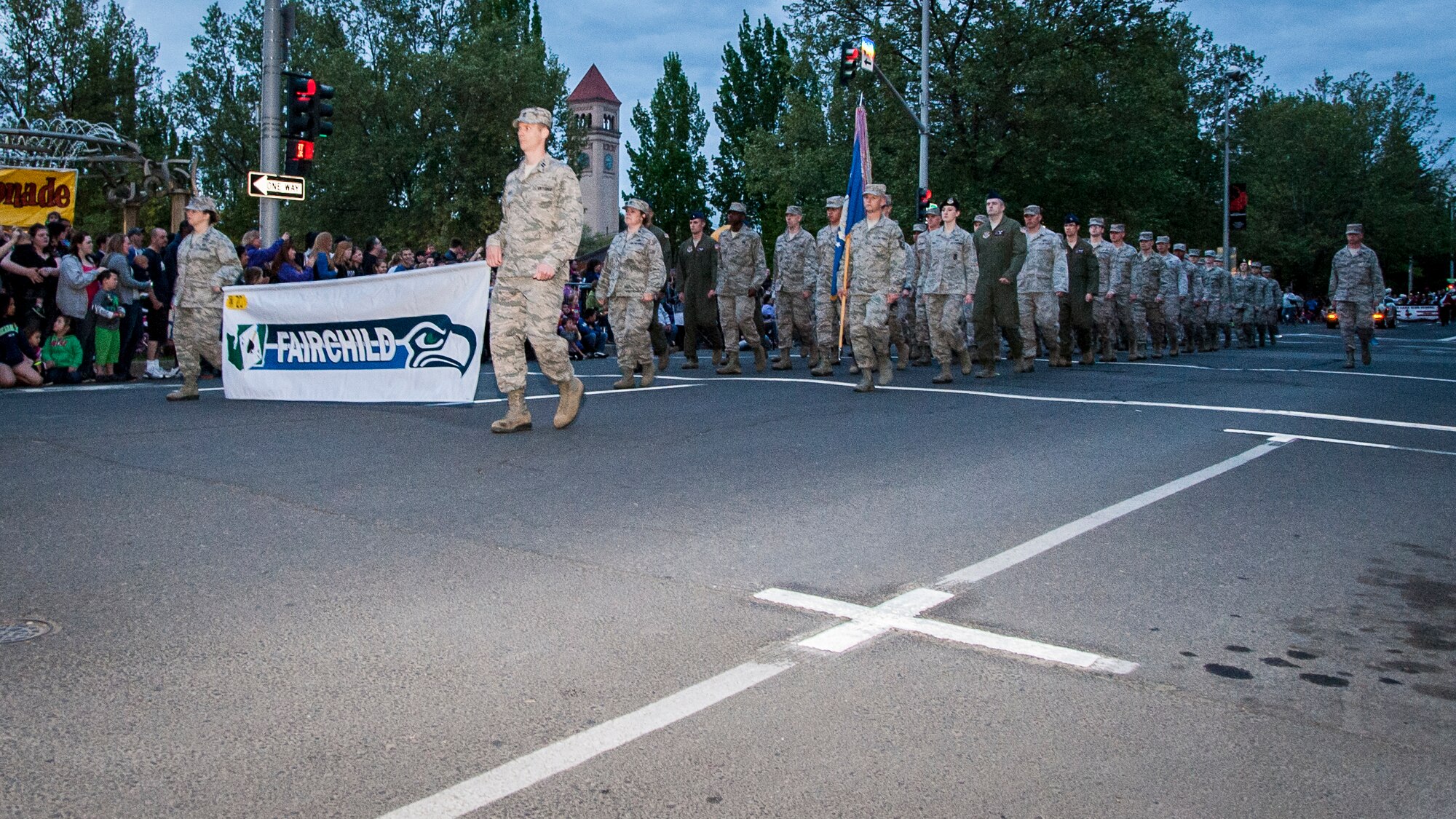 Airmen from Fairchild Air Force Base, Wash., march in formation during the 75th Annual Lilac Festival Armed Forced Torchlight Parade in Spokane, Wash., May 17, 2014. The parade is the largest armed forces torchlight parade in the nation and is made to honor service members of both the past and present. (U.S. Air Force photo by Staff Sgt. Benjamin W. Stratton/Released)