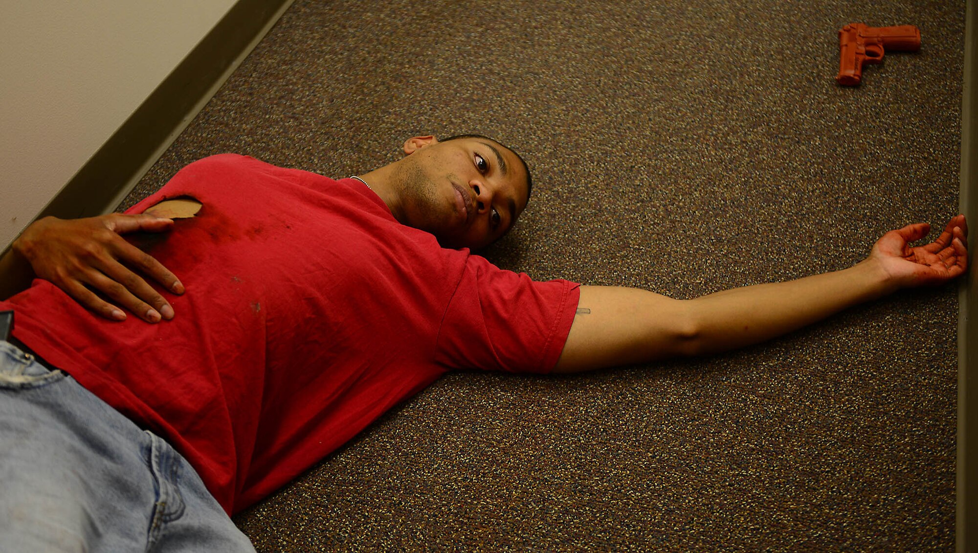 MOODY AIR FORCE BASE, Ga. – The active shooter lies dead in the base education office during an active shooter exercise at Moody Air Force Base, Ga., May 16, 2014. The exercise resulted in three mock deaths, two victims and the shooter. (U.S. Air Force photo by Senior Airman Tiffany M. Grigg/Released)