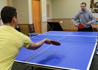 Capt. David Dayton, 341st Missile Wing Judge Advocate (right), and Staff Sgt. Jonathan Sandoval-Barba, 341st Civil Engineer Squadron member, play ping pong during Wing Sports Smackdown on May 16. The Big Sky Top 3 Association hosted the first WSS of the year. (U.S. Air Force photo/Senior Airman Katrina Heikkinen) 