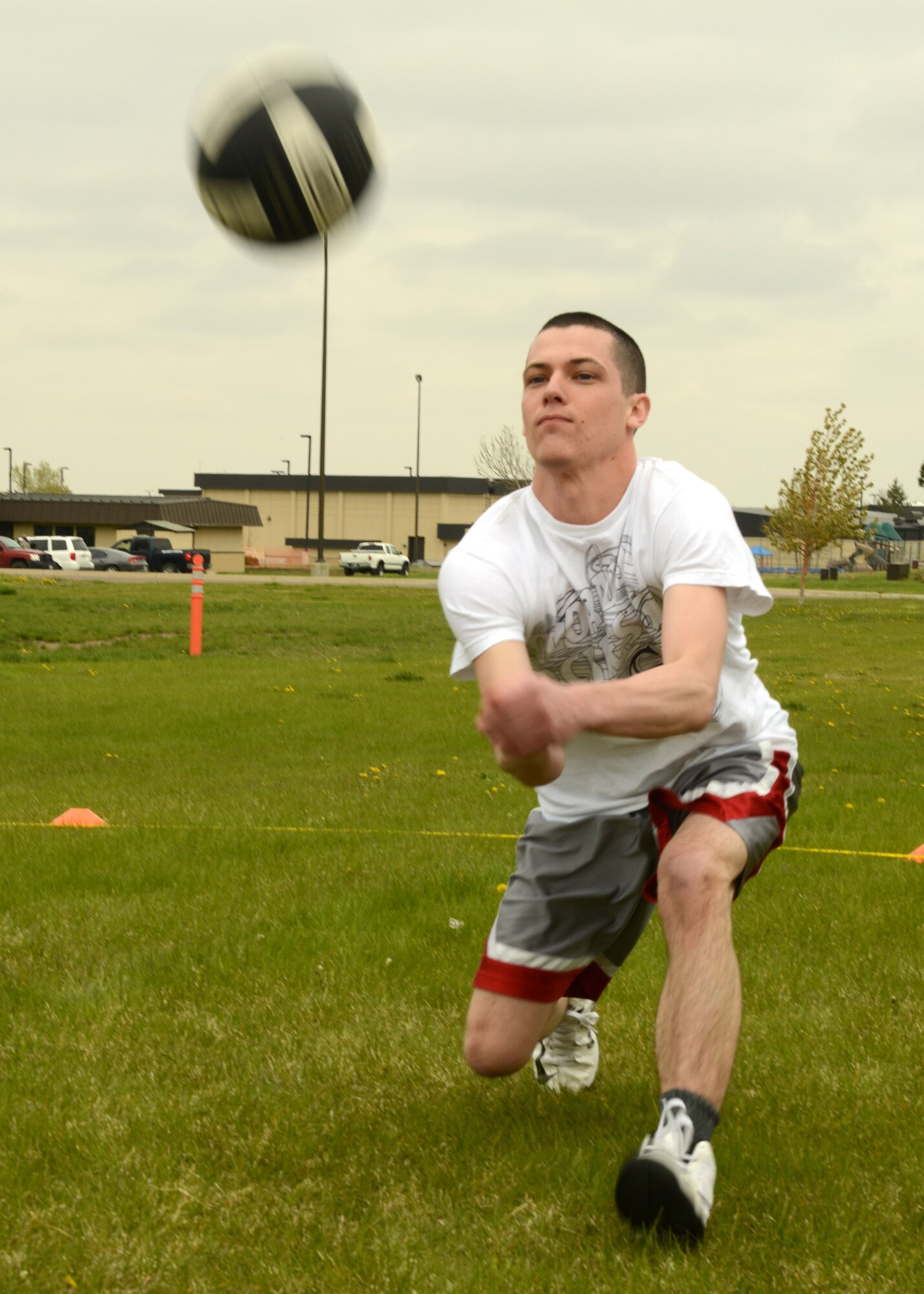 Airman 1st Class Joshua Dunrud, 341st Contracting Squadron specialist, hits a volleyball during a game against members from the the 341st Civil Engineer Squadron Explosive Ordnance Disposal team on May 16. The Big Sky Top 3 Association hosted the quarterly Wing Sports Smackdown. (U.S. Air Force photo/Senior Airman Katrina Heikkinen)