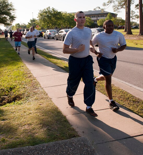 Participants approach the finish line during the 12th Annual Commando 5K Run at Hurlburt Field, Fla., May 16, 2014. The 1st Special Operations Force Support Squadron hosts morale-boosting fun runs every other month. (U.S. Air Force photo/Senior Airman Krystal M. Garrett) 