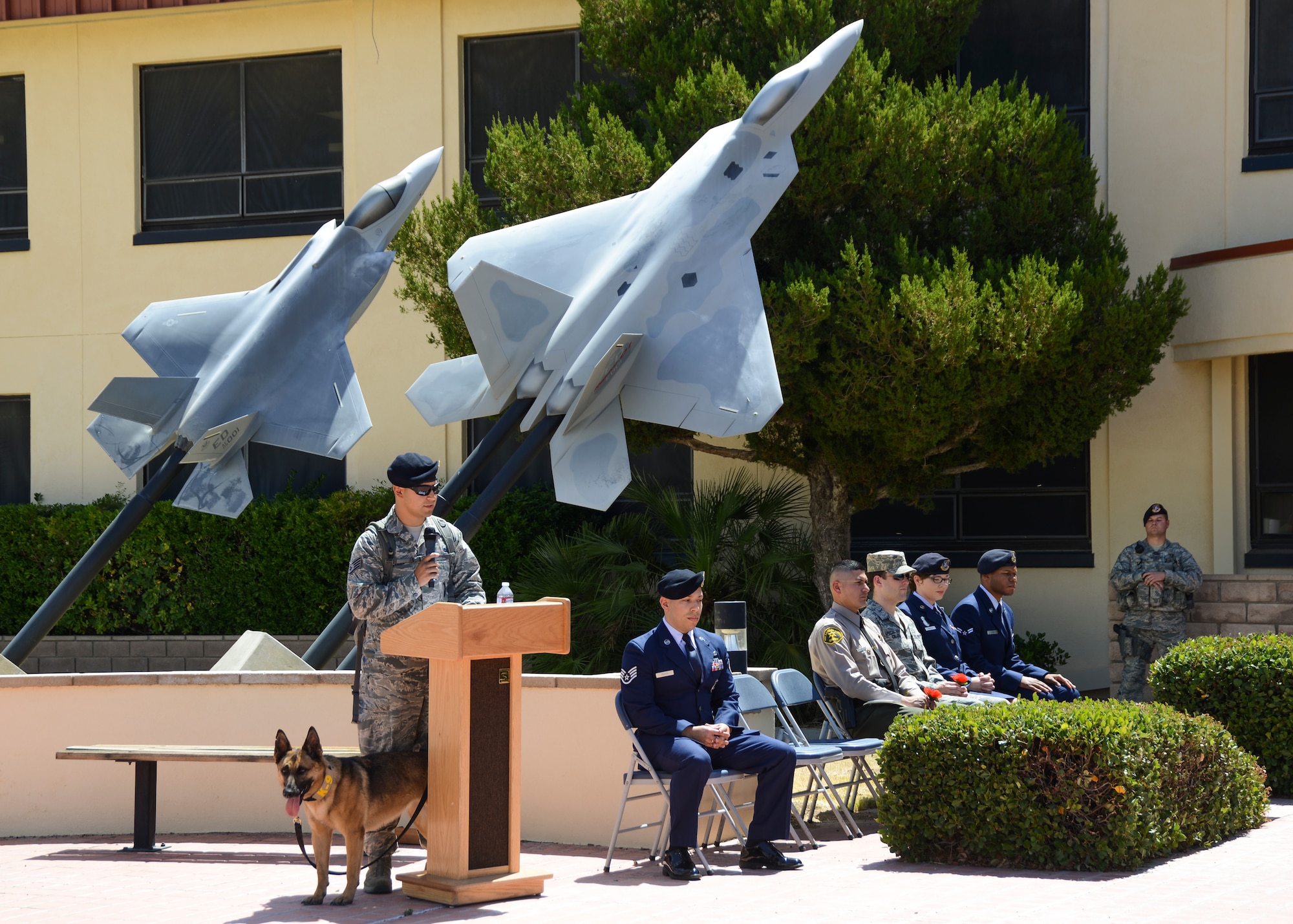 Staff Sgt. Adrian Castillo, 412th Security Forces Squadron, recites a poem about military working dogs during the End of Watch Ceremony May 16, for Police Week. (U.S. Air Force photo by Rebecca Amber)
