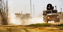 Members of the 791st Missile Security Forces Squadron convoy response force and 91st Security Support Squadron tactical response force respond to opposing forces during a recapture, recovery exercise at Minot Air Force Base, N.D., May 15, 2014. The purpose of this training is to maintain readiness for launch facility recapture. (U.S. Air Force photo/Senior Airman Brittany Y. Auld