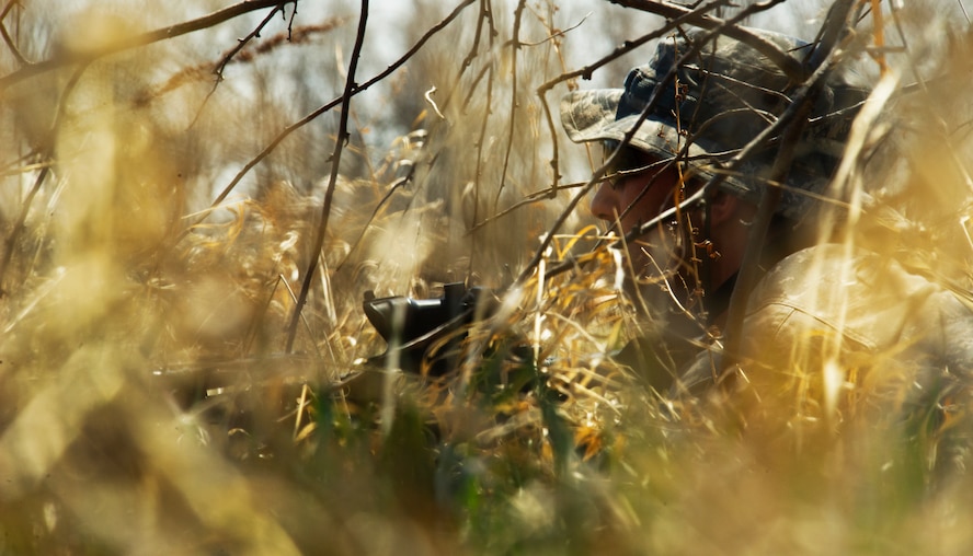 Senior Airman Christopher Sanson, 91st Security Support Squadron tactical response force member, provides cover during a recapture, recovery exercise at Minot Air Force Base, N.D., May 14, 2014. The purpose of this training is to maintain readiness for launch facility recapture. (U.S. Air Force photo/Senior Airman Brittany Y. Auld)