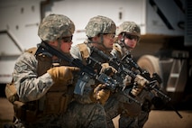Members of the 791st Missile Security Forces Squadron convoy response team survey their environment during an exercise at Minot Air Force Base, N.D., May 15, 2014. Members of the 791st MSFS and 91st Security Support Squadron tactical response force participated in the recapture and recovery exercise as part of training. (U.S. Air Force photo/Airman 1st Class Apryl Hall)