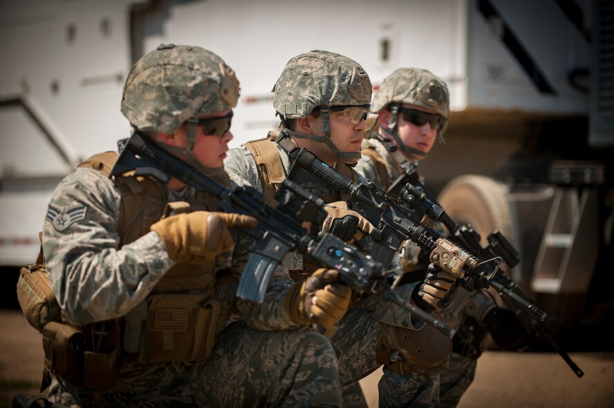 Members of the 791st Missile Security Forces Squadron convoy response team survey their environment during an exercise at Minot Air Force Base, N.D., May 15, 2014. Members of the 791st MSFS and 91st Security Support Squadron tactical response force participated in the recapture and recovery exercise as part of training. (U.S. Air Force photo/Airman 1st Class Apryl Hall)