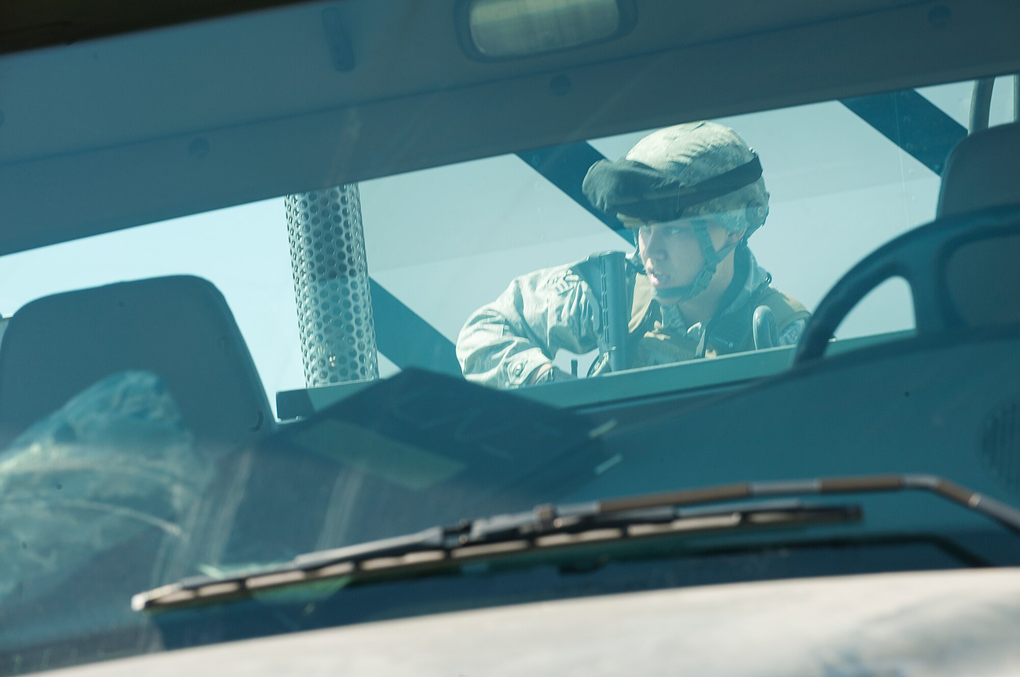 Senior Airman Franklin Sloat, 791st Missile Security Forces Squadron response force leader, examines a payload transporter during an exercise at Minot Air Force Base, N.D., May 15, 2014. Recapture and recovery exercises provide defenders an opportunity to train for certain scenarios. (U.S. Air Force photo/Airman 1st Class Apryl Hall)