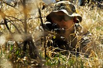 Senior Airman Christopher Sanson, 91st Security Support Squadron tactical response force member, provides cover during a recapture, recovery exercise at Minot Air Force Base, N.D., May 14, 2014. The purpose of this training is to maintain readiness for launch facility recapture. (U.S. Air Force photo/Senior Airman Brittany Y. Auld)