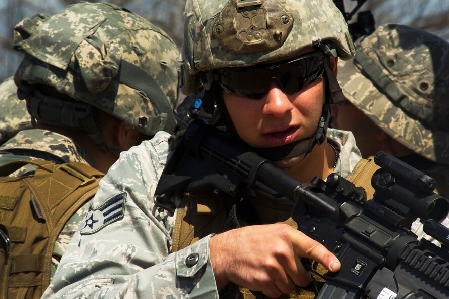 Senior Airman Joshua Knouff, 91st Security Support Squadron tactical response force member, provides cover during a recapture, recovery exercise at Minot Air Force Base, N.D., May 15, 2014. The purpose of this training is to maintain readiness for launch facility recapture. (U.S. Air Force photo/Senior Airman Brittany Y. Auld)