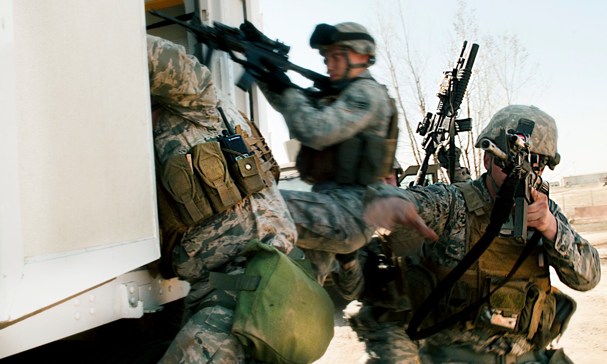 Members of the 791st Missile Security Forces Squadron convoy response force respond to opposing forces during a recapture, recovery exercise at Minot Air Force Base, N.D., May 15, 2014. The purpose of this training is to maintain readiness for launch facility recapture. (U.S. Air Force photo/Senior Airman Brittany Y. Auld) 
