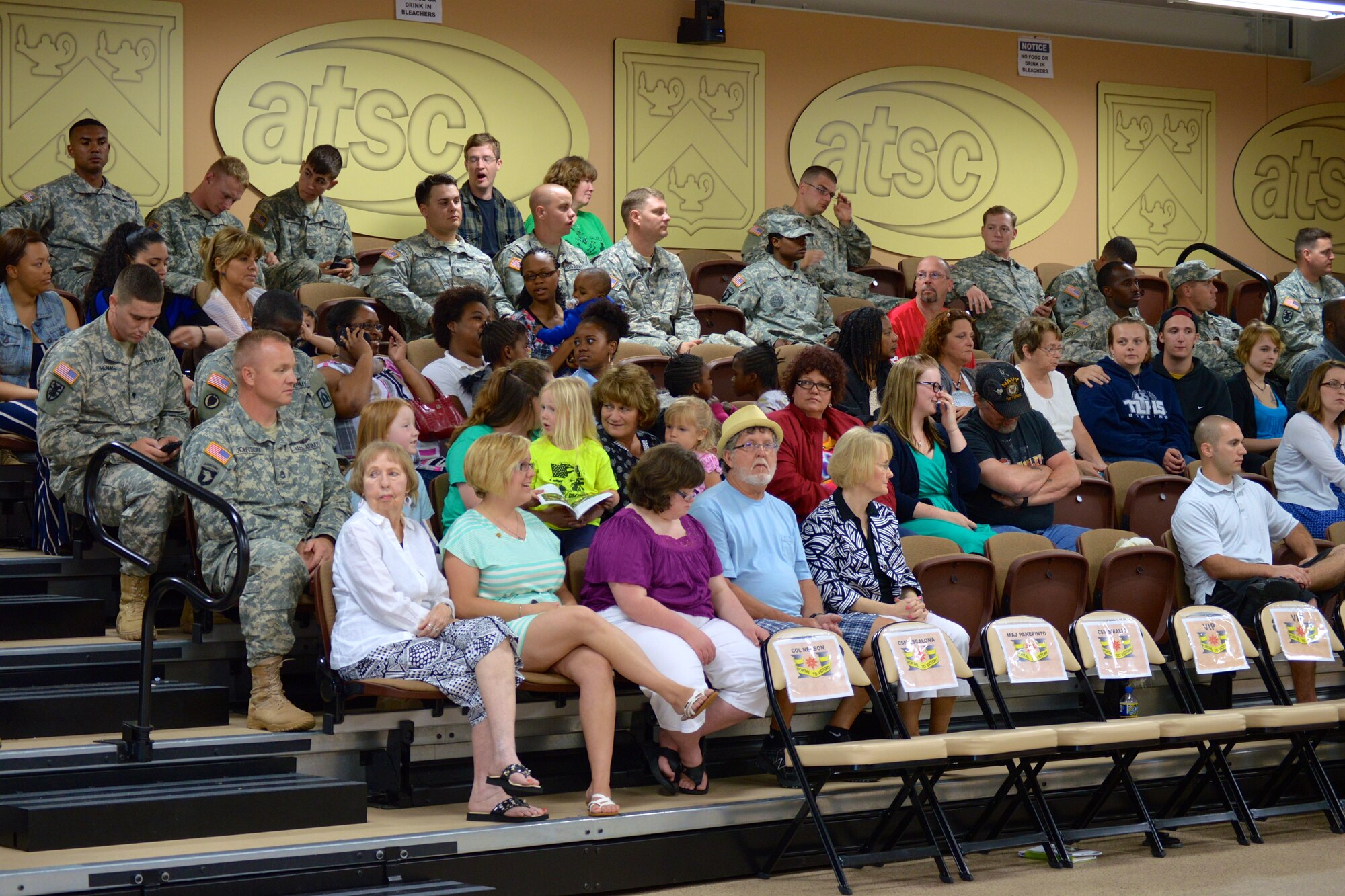 U.S. Army Soldiers, family and friends of the 492nd Transportation Detachment (Harbormaster), 10th Transportation Battalion, 7th Transportation Brigade (Expeditionary), wait for a deployment ceremony to commence at Fort Eustis, Va., May 16, 2014. During their deployment to Kuwait, the Soldiers will be responsible for port management, watercraft safety and planning, as well as coordinating and supervising watercraft missions. (U.S. Army photo by Spc. Marian Alleva /Released)