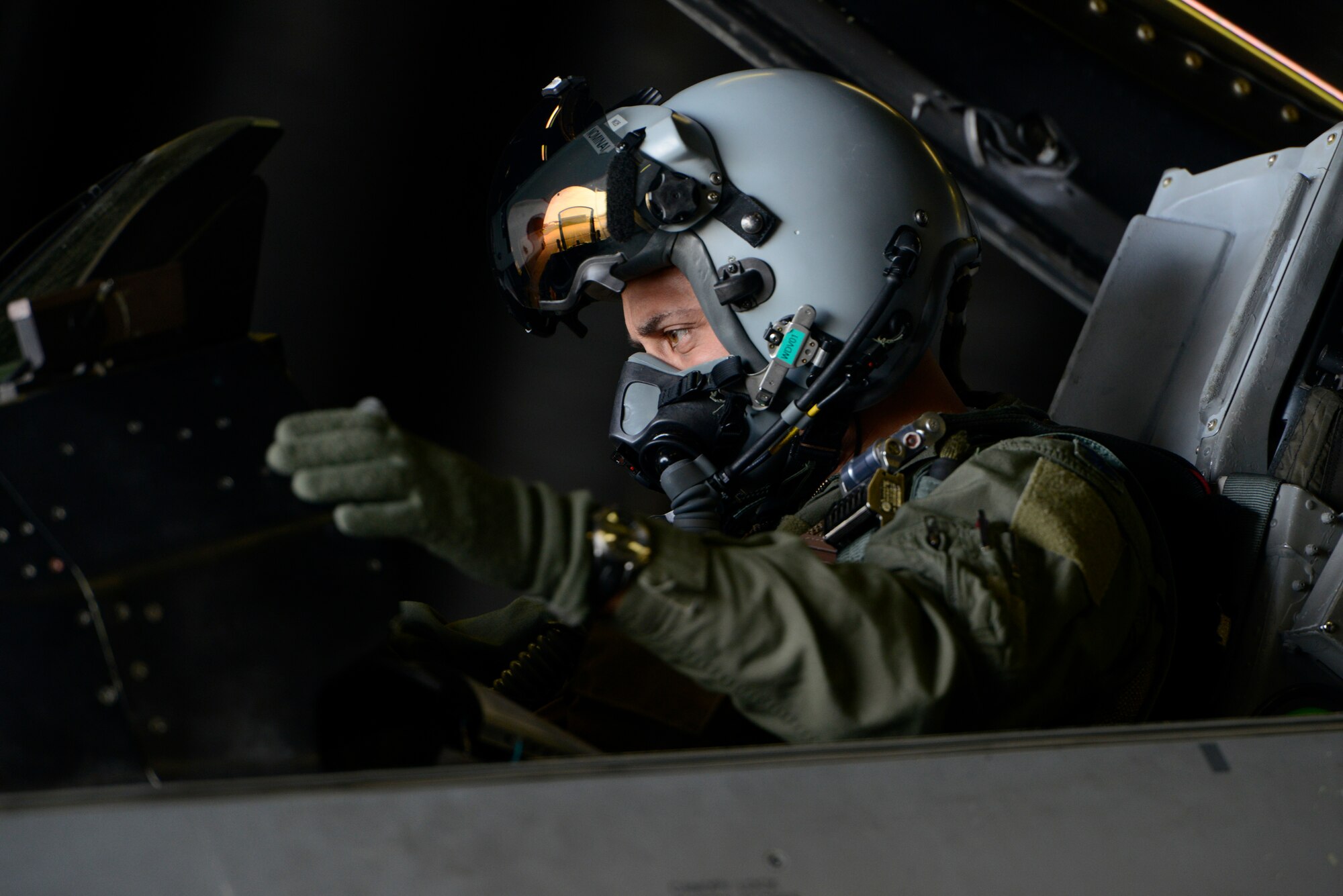 U.S. Air Force Col. David Julazadeh, 52nd Fighter Wing commander, prepares for his final flight in a U.S. Air Force F-16 Fighting Falcon fighter aircraft May, 20, 2014, at Spangdahlem Air Base, Germany. This flight is an Air Force tradition commemorating the departure of a commander or accompanying a milestone in the career of an entire aircrew. (U.S. Air Force photo by Staff Sgt. Christopher Ruano/Released)