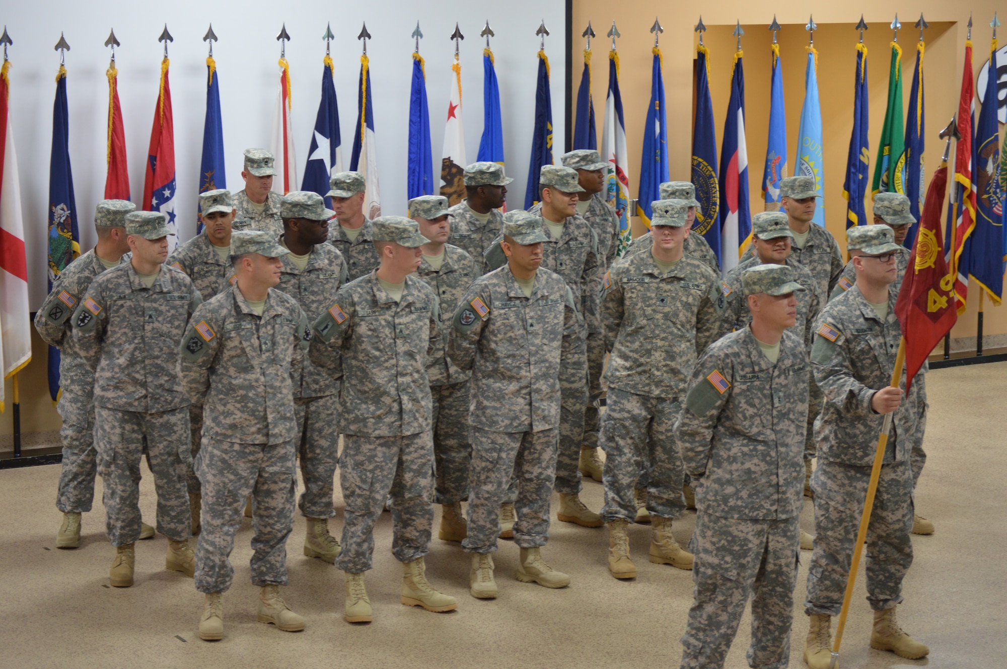 Soldiers assigned to the 492nd Transportation Detachment (Harbormaster), 10th Transportation Battalion, 7th Transportation Brigade (Expeditionary), stand in formation during a deployment ceremony at Fort Eustis, Va., May 16, 2014. The unit is deploying in support of Operation Enduring Freedom. (U.S. Army photo by Spc. Marian Alleva/Released)