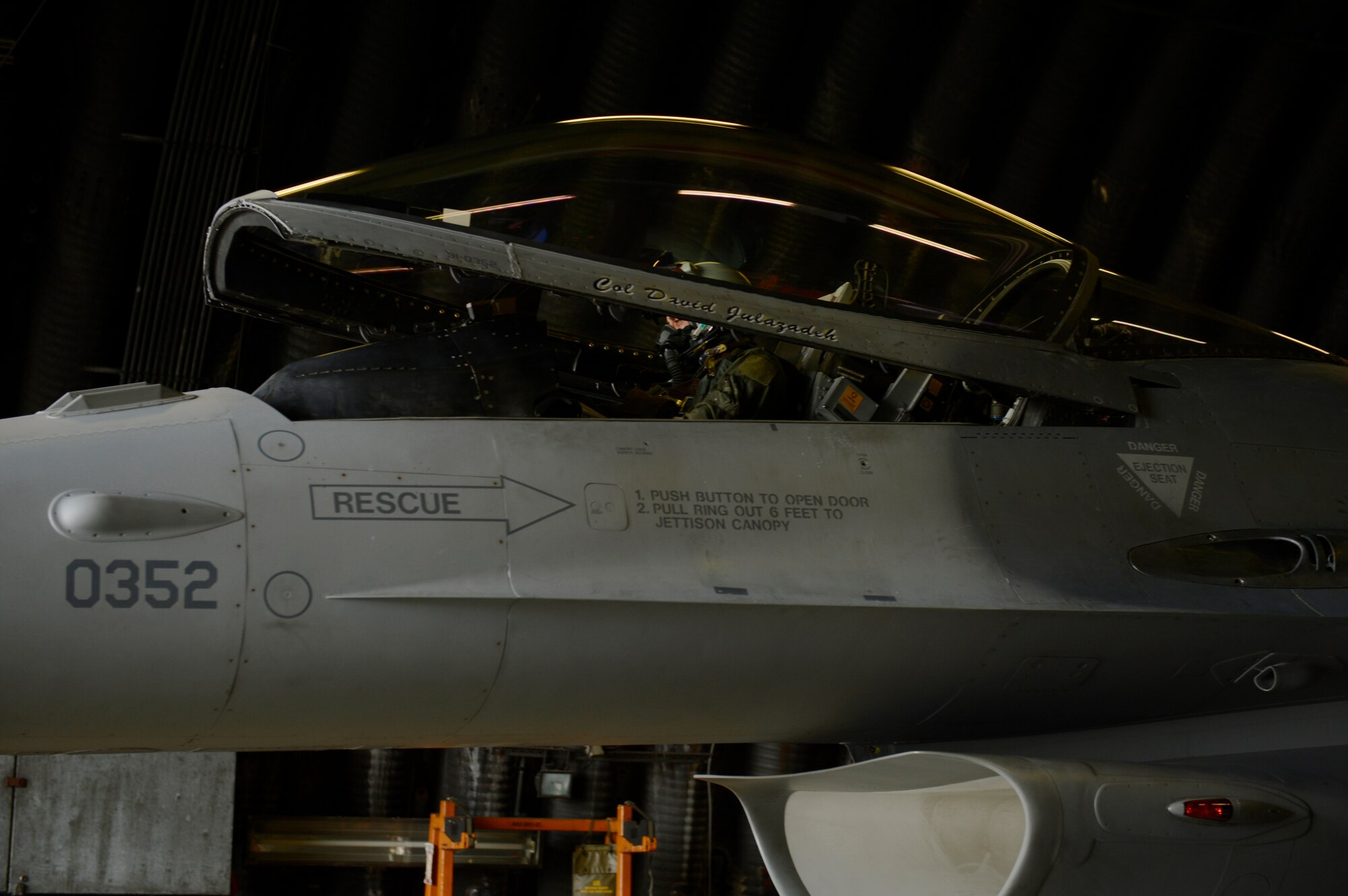 U.S. Air Force Col. David Julazadeh, 52nd Fighter Wing commander, lowers the canopy on a U.S. Air Force F-16 Fighting Falcon fighter aircraft during his final flight May, 20, 2014, at Spangdahlem Air Base, Germany. Julazadeh has been the 52nd FW commander for two years. (U.S. Air Force photo by Staff Sgt. Christopher Ruano/Released)