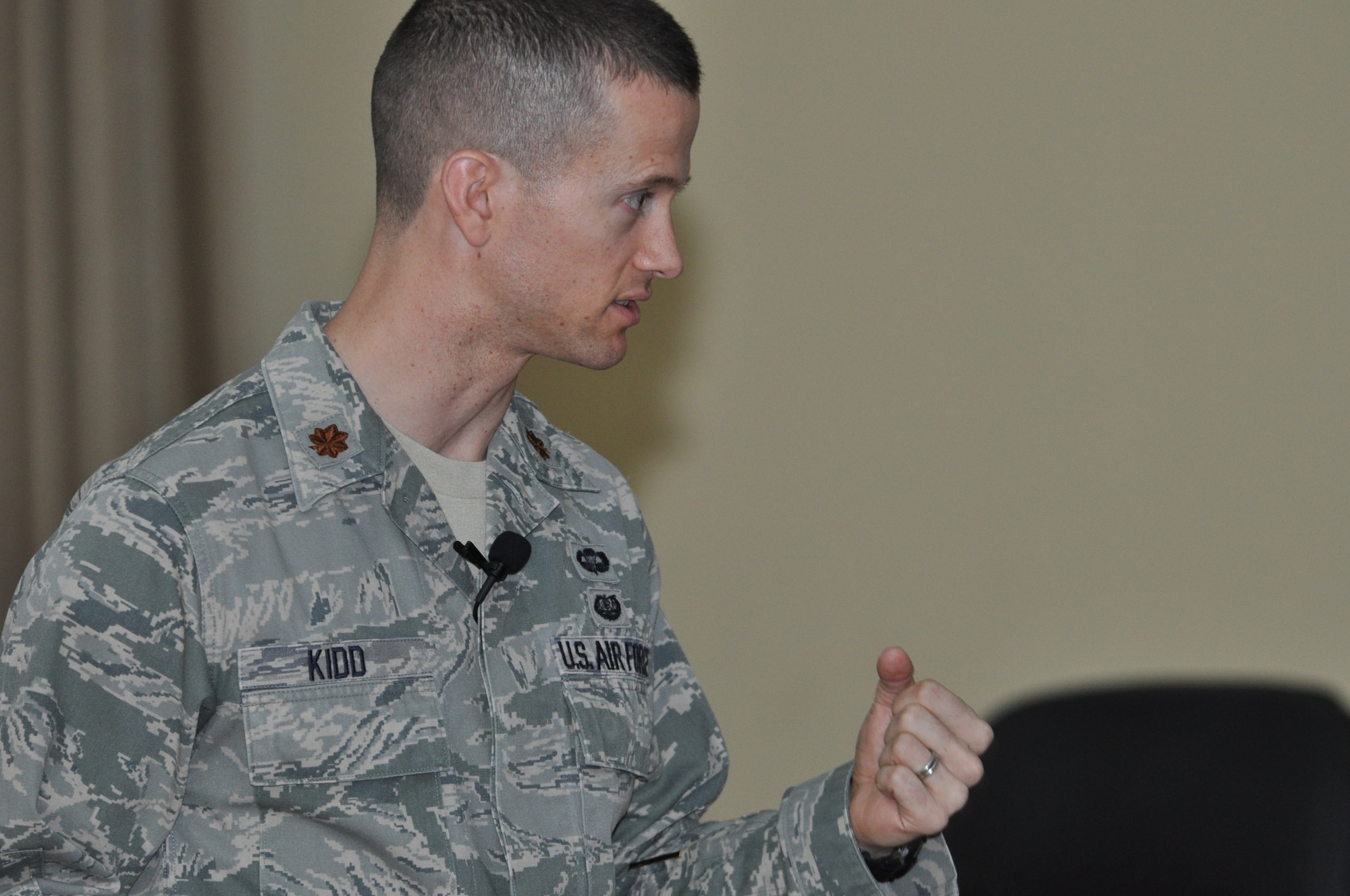 U.S. Air Force Maj. Sam Kidd, 386th Air Expeditionary Wing staff judge advocate, presents opening arguments to a panel during a mock jury trial at the Rock Theater May 14, 2014 at an undisclosed location in Southwest Asia. The mock jury trial was held to educate attendees about the military justice system and the adverse effects of sexual assault.(U.S. Air Force photo by Senior Master Sgt. Allison Day)