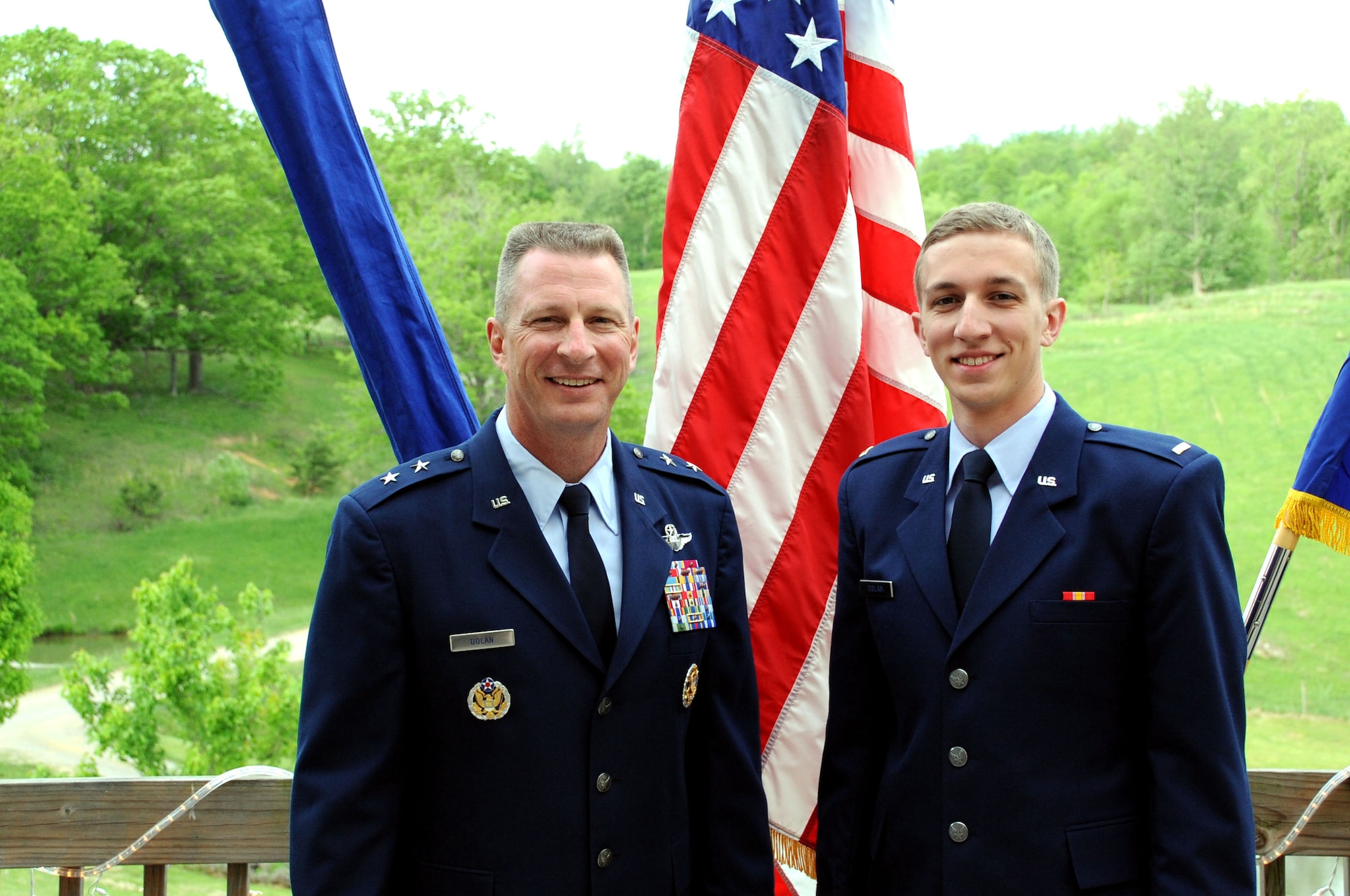 Maj. Gen. John Dolan, Assistant Deputy Commander for U.S. Air Forces Central Command and Assistant Vice Commander for the 9th Air Expeditionary Task Force, 
poses with his son, 2nd Lt. Joe Dolan, after a promotion ceremony in Blacksburg, Va., May 17, 2014. Lieutenant Dolan was given the unique opportunity to proctor his father's promotion ceremony a day after his father commissioned him. (U.S. Air Force photo by Staff Sgt. Katherine Holt)