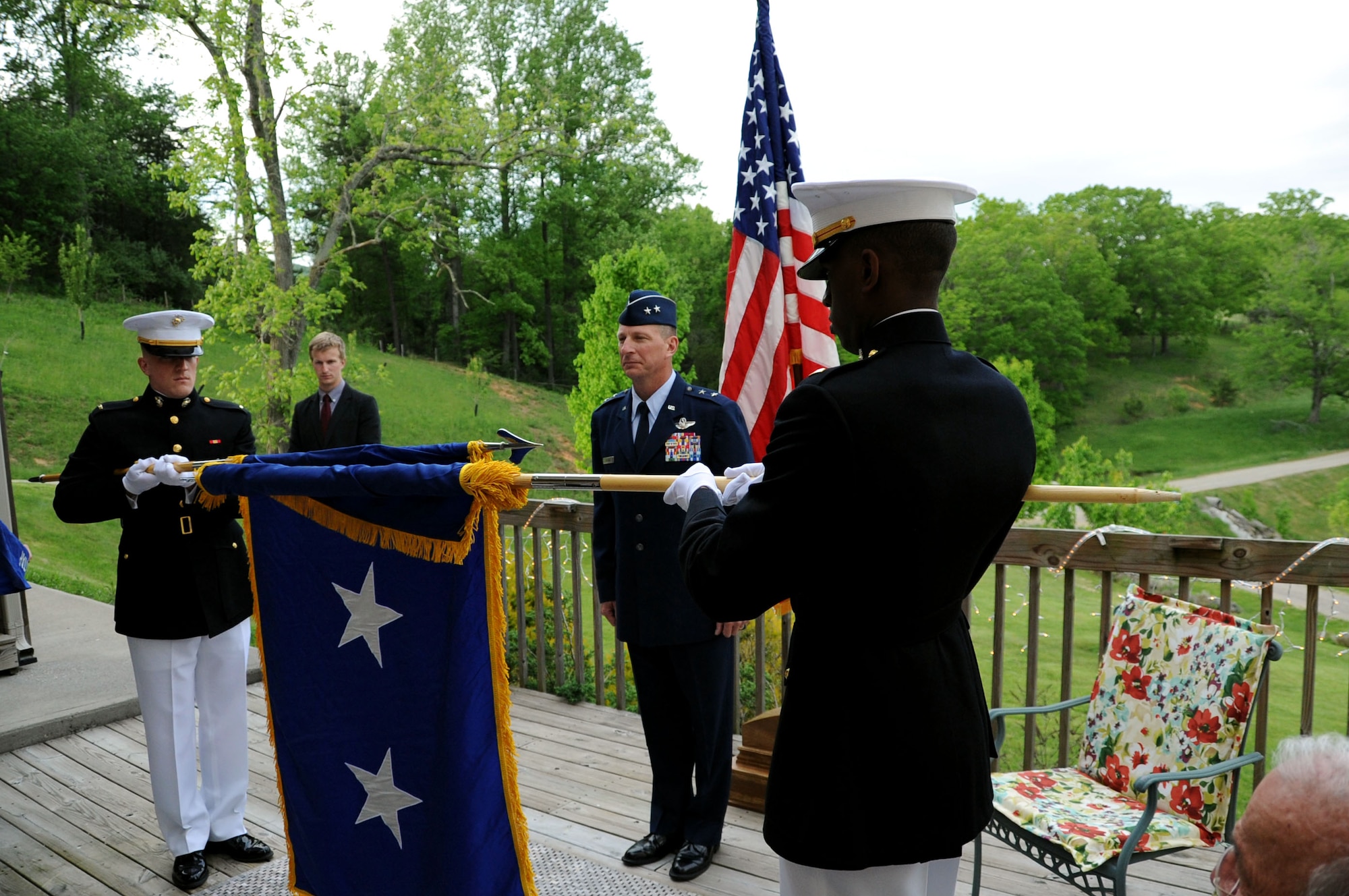Maj. Gen. John Dolan, Assistant Deputy Commander for U.S. Air Forces Central Command and Assistant Vice Commander for the 9th Air Expeditionary Task Force, 
watches Marine 2nd Lts. Frank Blackmon (left) and Luke Carpenter unfurl his new ceremonial flag during a promotion ceremony in Blacksburg, Va., May 17, 2014. Dolan is set to assume the position of Chief of Staff, U.S. Pacific Command later this month. (U.S. Air Force photo by Staff Sgt. Katherine Holt)