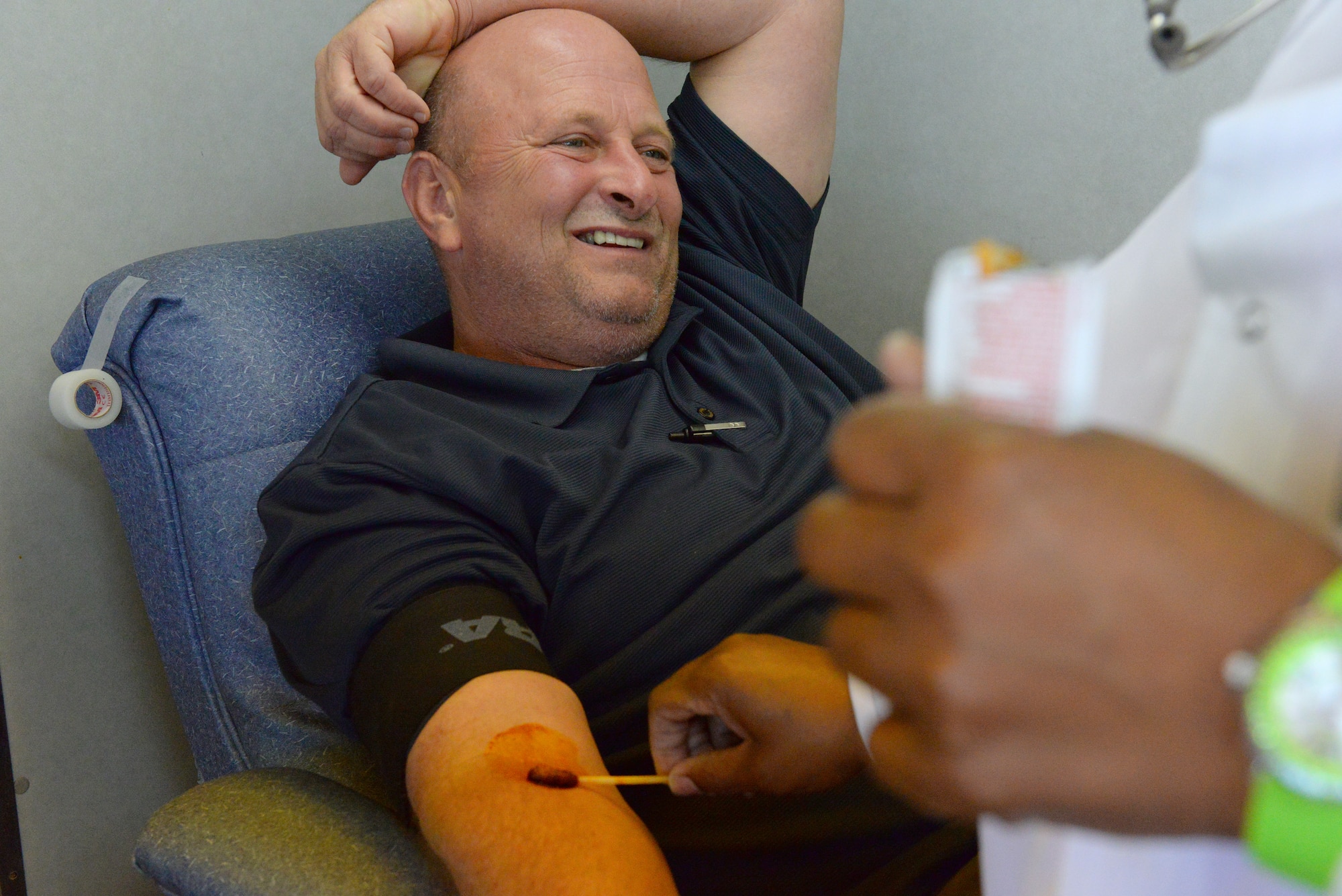 Rob Healy, 20th Security Forces Squadron investigator, is prepping to donate blood during a National Police Week blood drive at Sumter County Library, Sumter, S.C., May 16, 2014. Shaw Air Force Base 20th SFS participated in events with local and state law enforcement agencies including a golf tournament, prayer breakfast, pistol match, blood drive and 5K race. (U.S. Air Force photo by Airman 1st Class Diana M. Cossaboom/Released)
