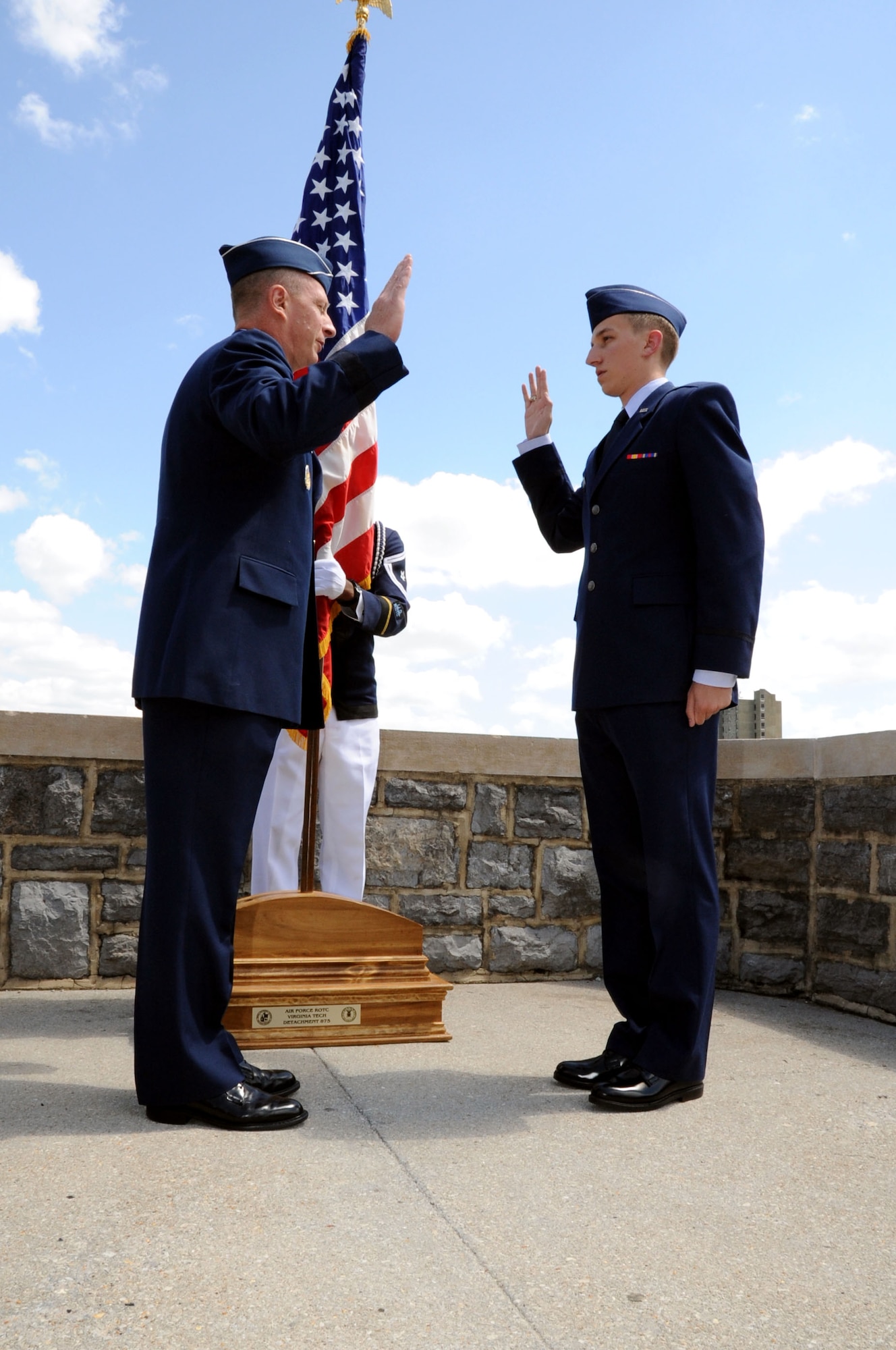 Brig. Gen. John Dolan, Assistant Deputy Commander for U.S. Air Forces Central Command and Assistant Vice Commander for the 9th Air Expeditionary Task Force, gives the Oath of Commissioned Officers to his son, Air Force Reserve Officer Training Corps Cadet Joe Dolan, during a commissioning ceremony at Virginia Tech University in Blacksburg, Va., May 16, 2014. Dolan was named AFROTC Distinguished Graduate and was selected to the remotely-piloted aircraft pilot career field. (U.S. Air Force photo by Staff Sgt. Katherine Holt)