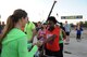 U. S. Army Private 1st Class Lakendra Smith, 57th Air Defense Artillery human resource specialist, receives her check-in number for the quarterly Dutch Sports Organization Half Marathon May 18, 2014, Incirlik Air Base, Turkey. More than 120 participants from multiple countires and military services entered the race. (U.S. Air Force photo by Staff Sgt. Eboni Reams/Released)