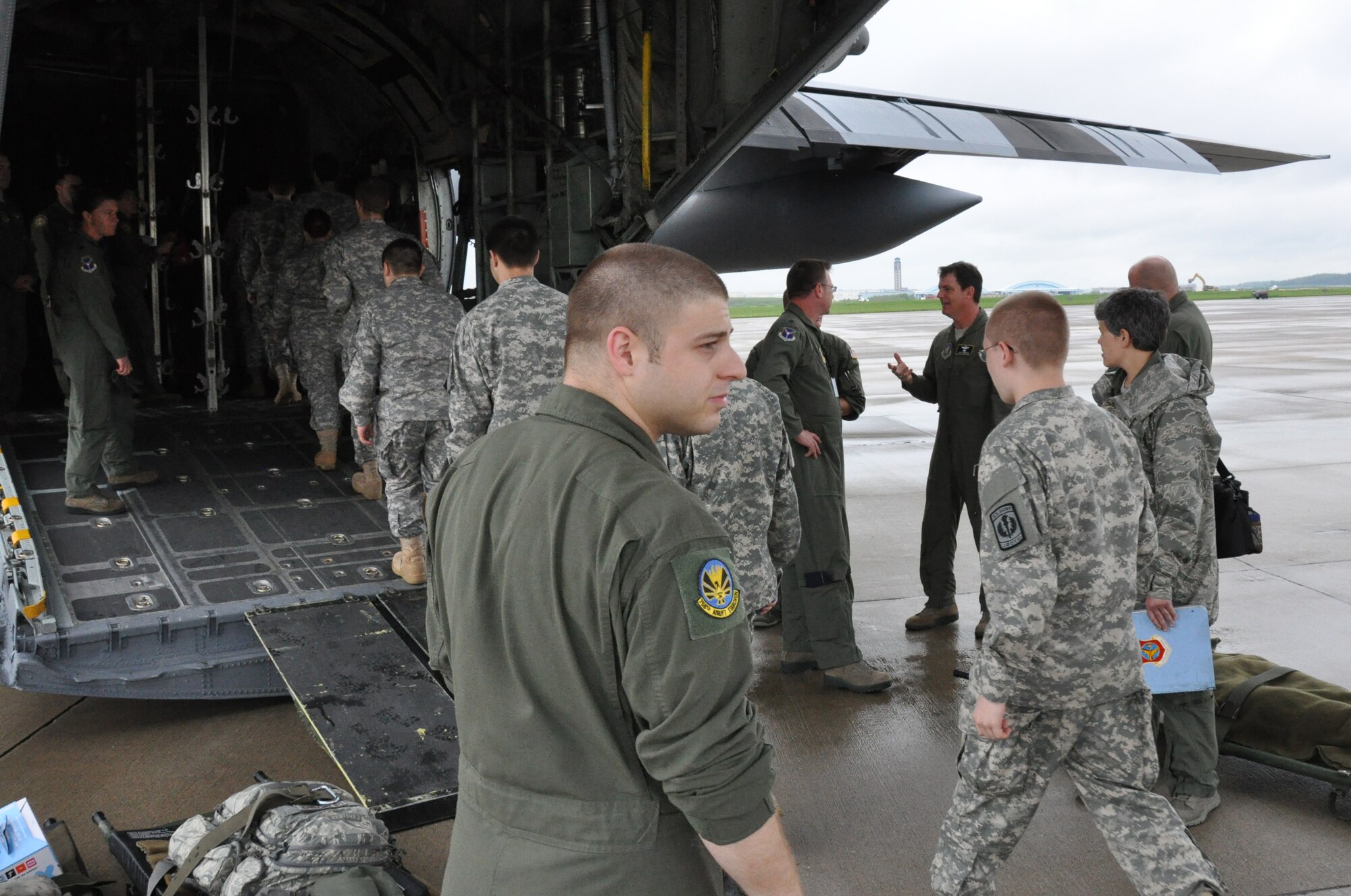 Members of the 911th Airlift Wing and cadets of the Butler Army Junior ROTC Golden Tornado Battalion board a C-130 Hercules and prepare for a local mission flight at the Pittsburgh International Airport Air Reserve Station, May 12, 2014. Cadets split into two groups and took part in two separate aeromedical training exercises to add to the experience of the 911th AW members conducting the training. For some cadets, this was their very first experience with an Air Force aircraft and the Air Force Reserve. (U.S. Air Force photo by Senior Airman Marjorie A. Bowlden)
