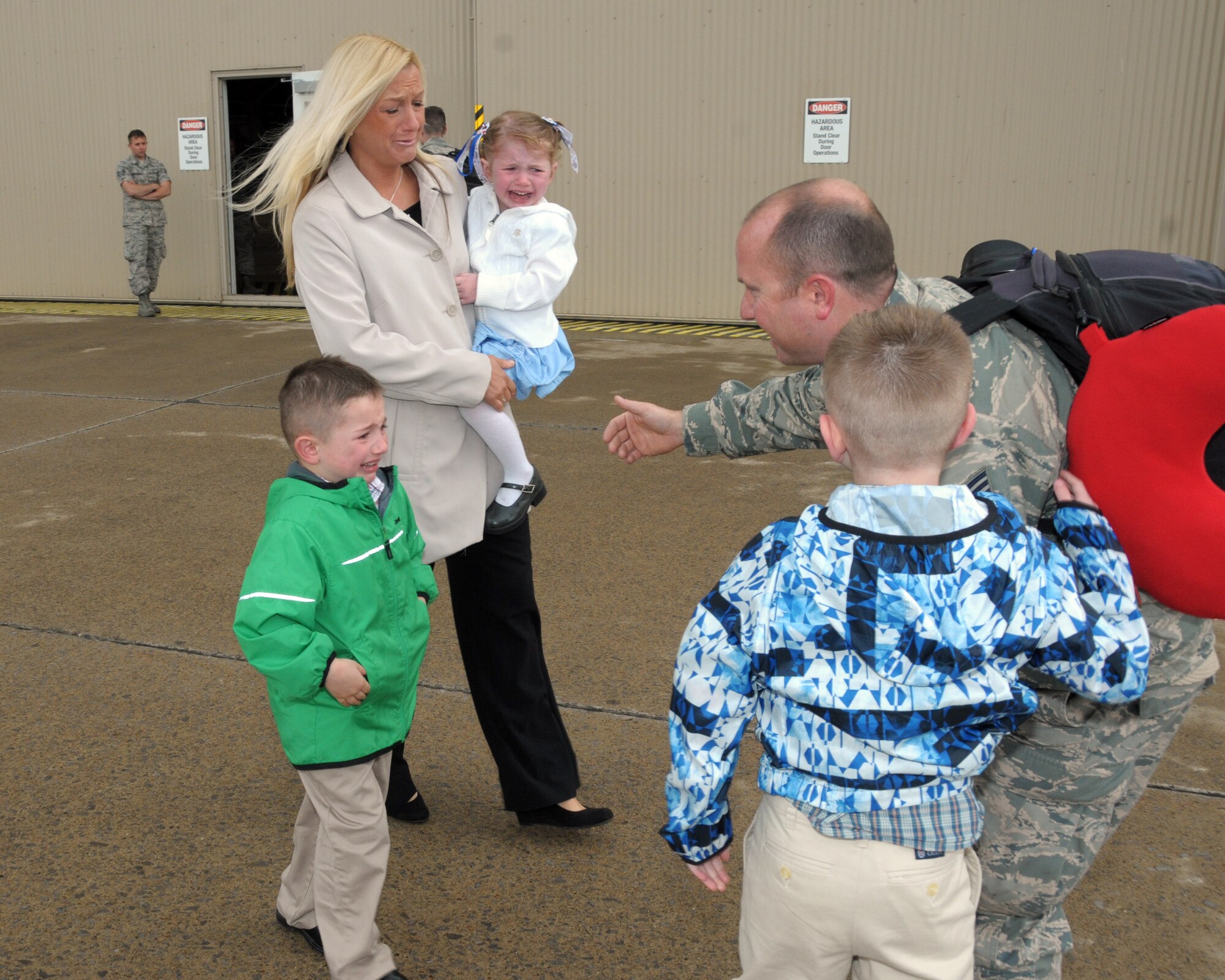 Nothing but tears of joy awaits this 914th Airlift Wing member at the Niagara Falls Air Reserve Station, N.Y. May 19, 2014. Mom and kids missed dad who was deployed overseas and is now finally home. (U.S. Air Force photo by Peter Borys) 