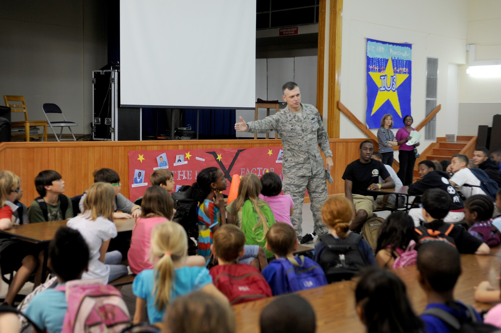 Col. Craig Wills, 39th Air Base Wing commander, leads Incirlik Unit School students in a “Hodja chant” before they participate in Job Shadow Day May 16, 2014, Incirlik Air Base, Turkey. Shadow Day is held annually to allow prekindergarten through 12th grade students an opportunity to spend the day with someone who works on base. (U.S. Air Force photo by Tech. Sgt. Dallas Edwards/Released)