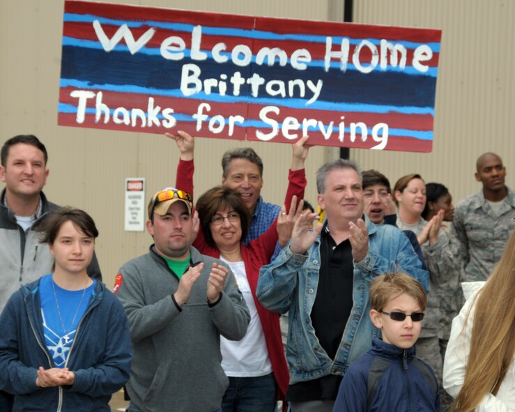 Family members anxiously await their loved ones coming home. Family and friends were on hand at the Niagara Falls Air Reserve Station, N.Y. May 19, 2014 to welcome home members of the 914 th Airlift Wing who were deployed overseas. (U.S. Air Force photo by Peter Borys)