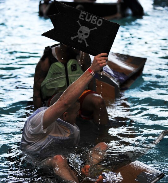 Battle of the Battleships participants go through the challenge round where the last boat left floating wins at the base aquatic center on Ramstein Air Base, Germany, May 16, 2014. Battle of the Battleships is an annual competition hosted by the 86th Force Support Squadron in which teams construct boats out of cardboard and duct tape, then race them to and from the other end of the pool. (U.S. Air Force photo/Senior Airman Hailey Haux)