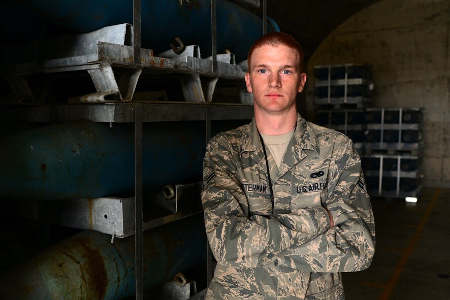 U.S. Air Force Airman 1st Class Cory Klosterman, 35th Maintenance Squadron munitions flight member, stands among dozens of inert Mark 82 Bombs inside a munitions igloo at Misawa Air Base, Japan, May 11, 2014. Klosterman has been stationed at Misawa AB for seven months and is following in the footsteps of his father and two grandfathers who all served in the U.S. Air Force. (U.S. Air Force photo/Senior Airman Derek VanHorn)