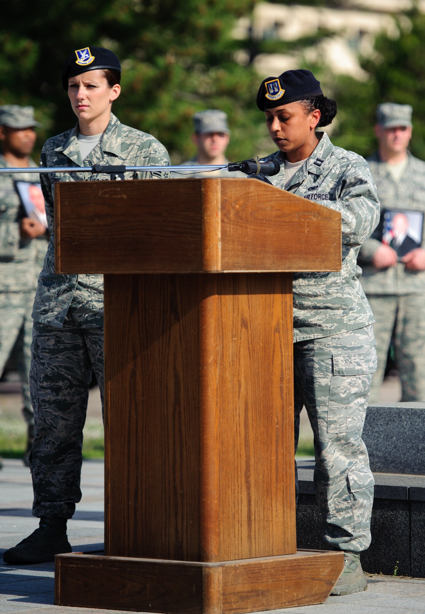 Capt. Lidia Iyassu, 8th Security Forces deputy commander, speaks on the importance of Police Week during a retreat ceremony at Kunsan Air Base, Republic of Korea, May 15, 2014. The 8th SFS honored 22 fallen defenders, office of special investigations agents and military working dogs as part of National Police Week. (U.S. Air Force photo by Senior Airman Armando A. Schwier-Morales/Released)