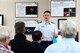 OFFUTT AIR FORCE BASE, Neb. -- Maj. Jeffrey Gipson, 2nd Weather Squadron director of operations, briefs visiting Air Force Space Command civic leaders at the state-of-the-art space weather operations Center located at their Air Force Weather Agency. The visit was just one stop on base for the group as they also toured U.S. Strategic Command, went inside an E-4B and met with one of the base’s local community support groups. (U.S. Air Force photo/Duncan Wood)