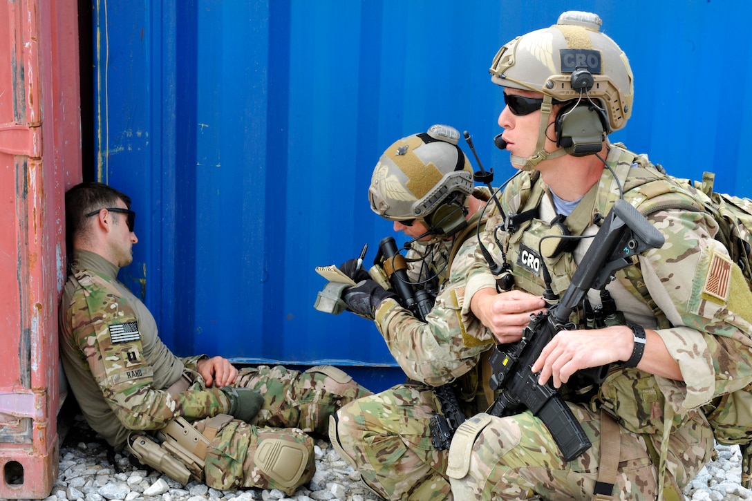 U.S. Army Capt. William Rand, left, simulates a wounded patient as U.S. Air Force Master Sgt. Duane Hayes, center, and U.S. Air Force 1st. Lt. Christopher Goetz, right, provide care and cover during a training exercise on Bagram Airfield, Afghanistan, May 5, 2014. Hayes, a pararescueman, and Goetz, a combat rescue officer, are assigned to the 83rd Expeditionary Rescue Squadron, 455th Air Expeditionary Wing.