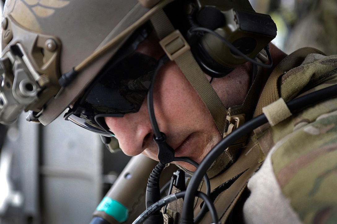 U.S. Air Force Senior Airman Derek Hemerick prepares his gear for a ...