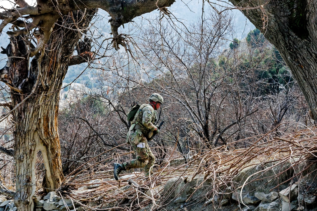 U.S. Army Staff Sgt. Chester Thomson runs up an embankment during a security patrol in a remote village of Khowst province, Afghanistan, Jan. 31, 2013. Thomson is assigned to the 101st Airborne Division’s Troop B, 1st Squadron, 33rd Cavalry Regiment, 3rd Brigade Combat Team.  
