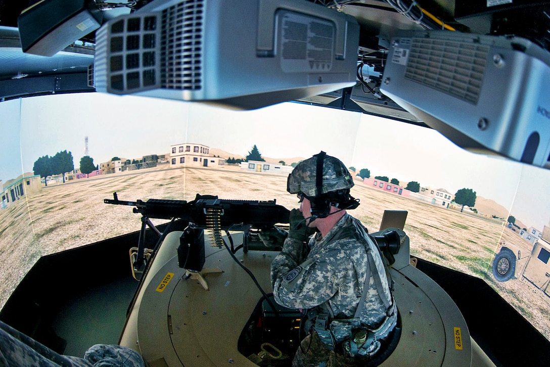 Army Sgt. Jonathan Eddy mans an M240B machine gun atop a Humvee in a virtual convoy trainer on Fort Bragg, N.C., Jan. 30, 2013. Eddy, a team leader, is assigned to the 82nd Airborne Division’s 1st Brigade Combat Team.  
