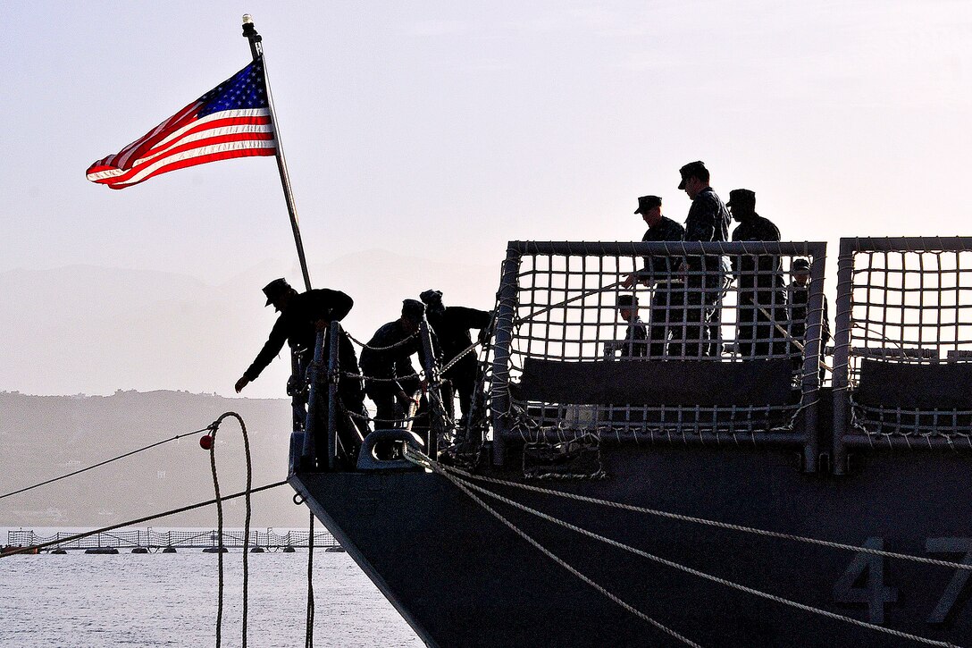 U.S. sailors aboard the guided-missile frigate USS Nicholas moor the ship as it arrives in Souda Bay, Greece, Feb. 4, 2013. The Nicholas is conducting maritime security operations and theater security cooperation efforts in the U.S. 6th Fleet area of responsibility.  
