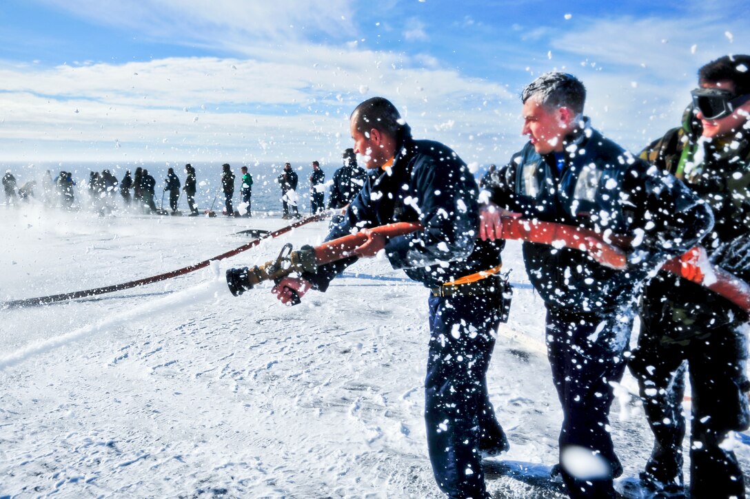 U.S. sailors participate in a flight deck scrubbing exercise aboard the aircraft carrier USS Carl Vinson in the Pacific Ocean, Feb. 3, 2013. The Vinson is conducting sea trials as the final stage of a six-month planned incremental availability. 
