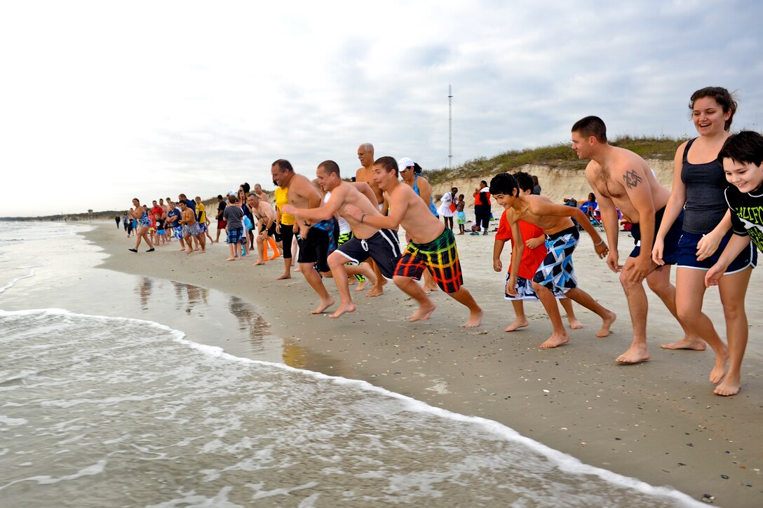 Service members, family and friends celebrate the new year by charging into the Atlantic Ocean during the Polar Plunge on Naval Station Mayport in Mayport, Fla., Jan. 1, 2013. 
