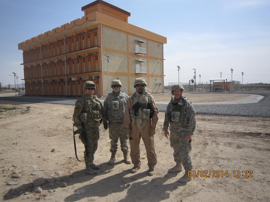 Kandahar University Law Library partial Project Delivery Team (PDT) on-site for Final Inspection.  Listed left to right are MAJOR Jeff Ward - Kandahar Resident Office OIC, John Wojciechowski (Wojo) - Construction Control Representative, Dan Foltz - Project Engineer and Stan Dowdy - Resident Engineer.