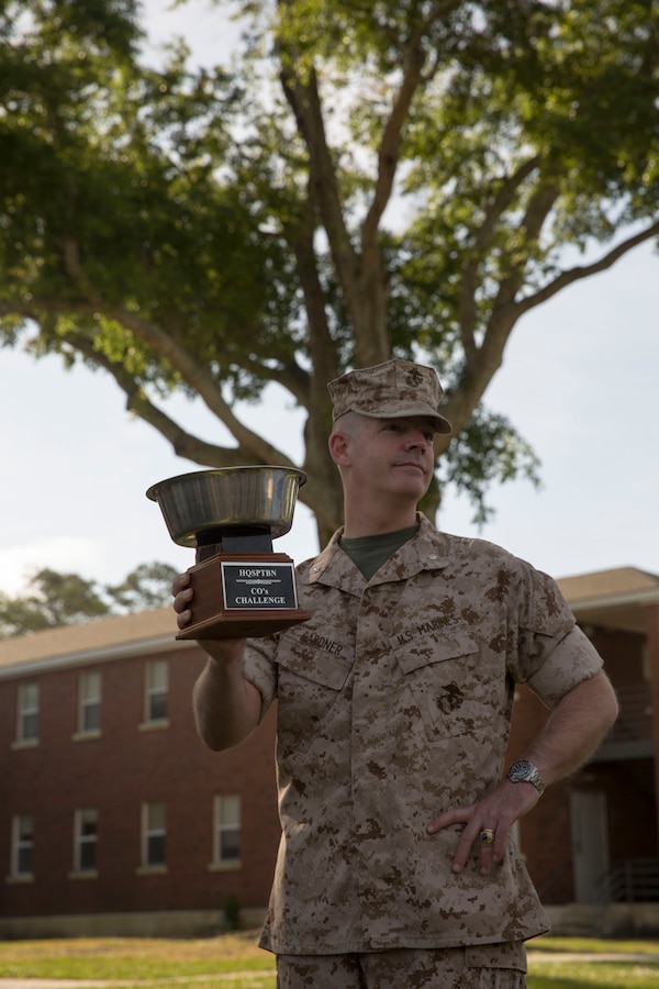Lt. Col. Harry Gardner, the commanding officer of Headquarters Support Battalion holds the CO’s Cup, a trophy awarded to the winner of the monthly Commander’s Cup Challenge event aboard Marine Corps Base Camp Lejeune, May 15.  The Commander’s Cup Challenge is a yearlong series of physical competitions where the battalion’s companies build teams to battle it out for fun and a chance to be the top company in the battalion.