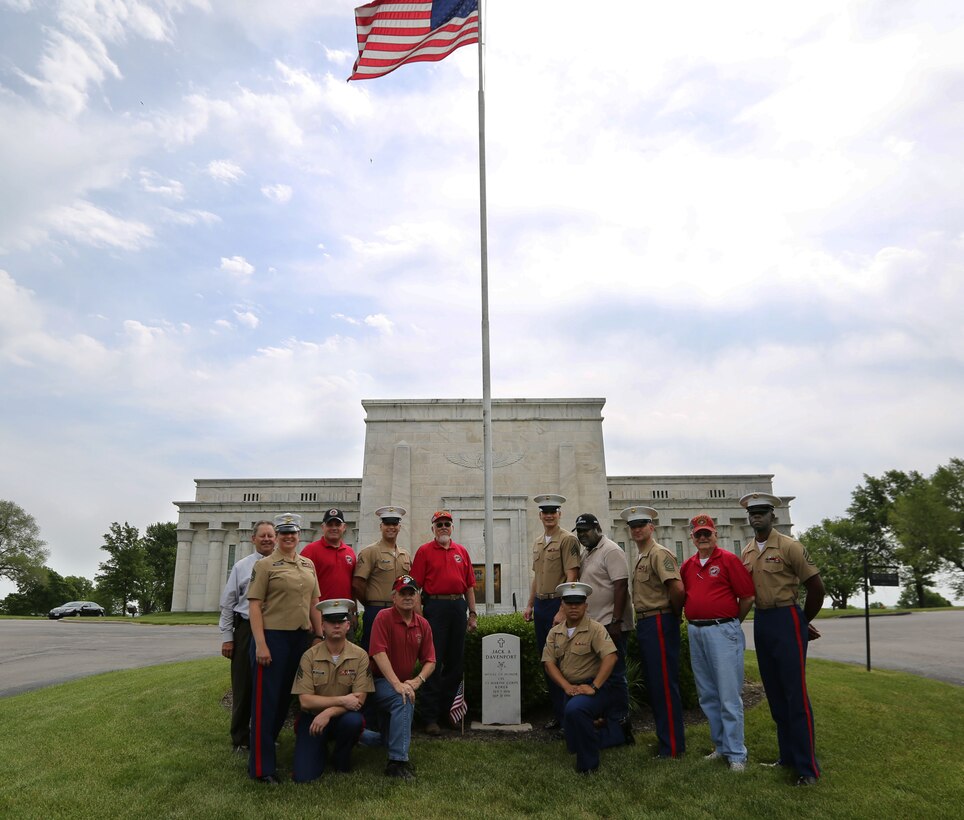 Marines of the 9th Marine Corps District and members of the Simpson Hoggat Marine Corps League detachment pose for a photo after placing dozens of American flags on the graves of passed veterans at Mount Moriah South Cemetery, May 21. 
