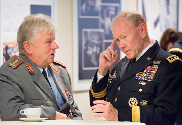 U.S. Army Gen. Martin E. Dempsey, right, chairman of the Joint Chiefs of Staff, speaks with German army Gen. Volker Wieker, chief of staff of the German Armed Forces, during a break from the NATO Chiefs of Defense meetings in Brussels, May 21, 2014. The alliance of 28-member countries discussed current military issues including the way ahead in Afghanistan, Ukraine and future threats.