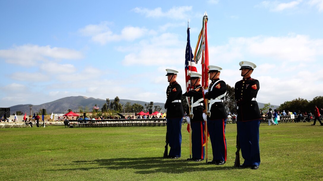 Corporal Justin G. Rush, right center, embarkation specialist, 15th Marine Expeditionary Unit, practices with the color guard before presenting the Colors during a commencement ceremony at Palomar College campus in San Marcos, Calif., May 20, 2014. Rush, 20, is from Tacoma, Wash. (U.S. Marine Corps photo by Cpl. Emmanuel Ramos/Released)