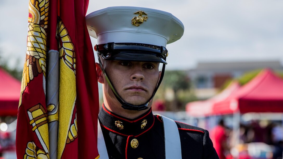 Corporal Justin G. Rush, embarkation specialist, 15th Marine Expeditionary Unit, mentally prepares to present the Colors during a commencement ceremony at Palomar College campus in San Marcos, Calif., May 20, 2014. Rush, 20, is from Tacoma, Wash. (U.S. Marine Corps photo by Lance Cpl. Anna Albrecht/Released)