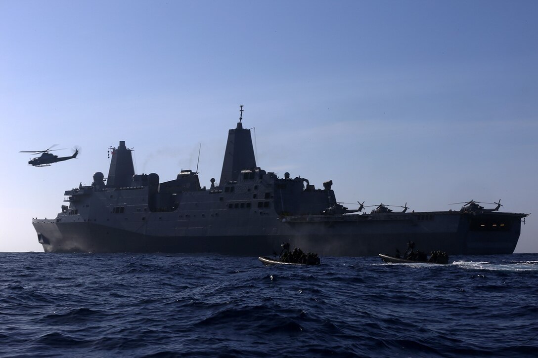 Marines with the Force Reconnaissance Detachment, 11th Marine Expeditionary Unit and sailors with Assault Craft Unit 1, Amphibious Squadron 5, deploy in rigid hull inflatable boats from the USS San Diego as part of a visit board search and seizure mission conducted during Composite Training Unit Exercise off the coast of southern California, May 17, 2014. COMPTUEX is the second at-sea event in the 11th MEU and Makin Island Amphibious Ready Group joint predeployment training program, during which they will refine mission-related operations and blue-green communication. (U.S. Marine Corps photo by Gunnery Sgt. Rome M. Lazarus/Released)