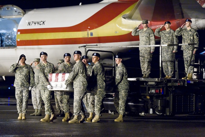 A U.S. Army carry team transfers the remains of Army Spc. Adrian M. Perkins of Pine Valley, Calif., May 21, 2014, at Dover Air Force Base, Del. Perkins was assigned to the 1st Battalion, 67th Armor Regiment, 2nd Brigade Combat Team, 4th Infantry Division, Fort Carson, Colo. (U.S. Air Force photo/Roland Balik)