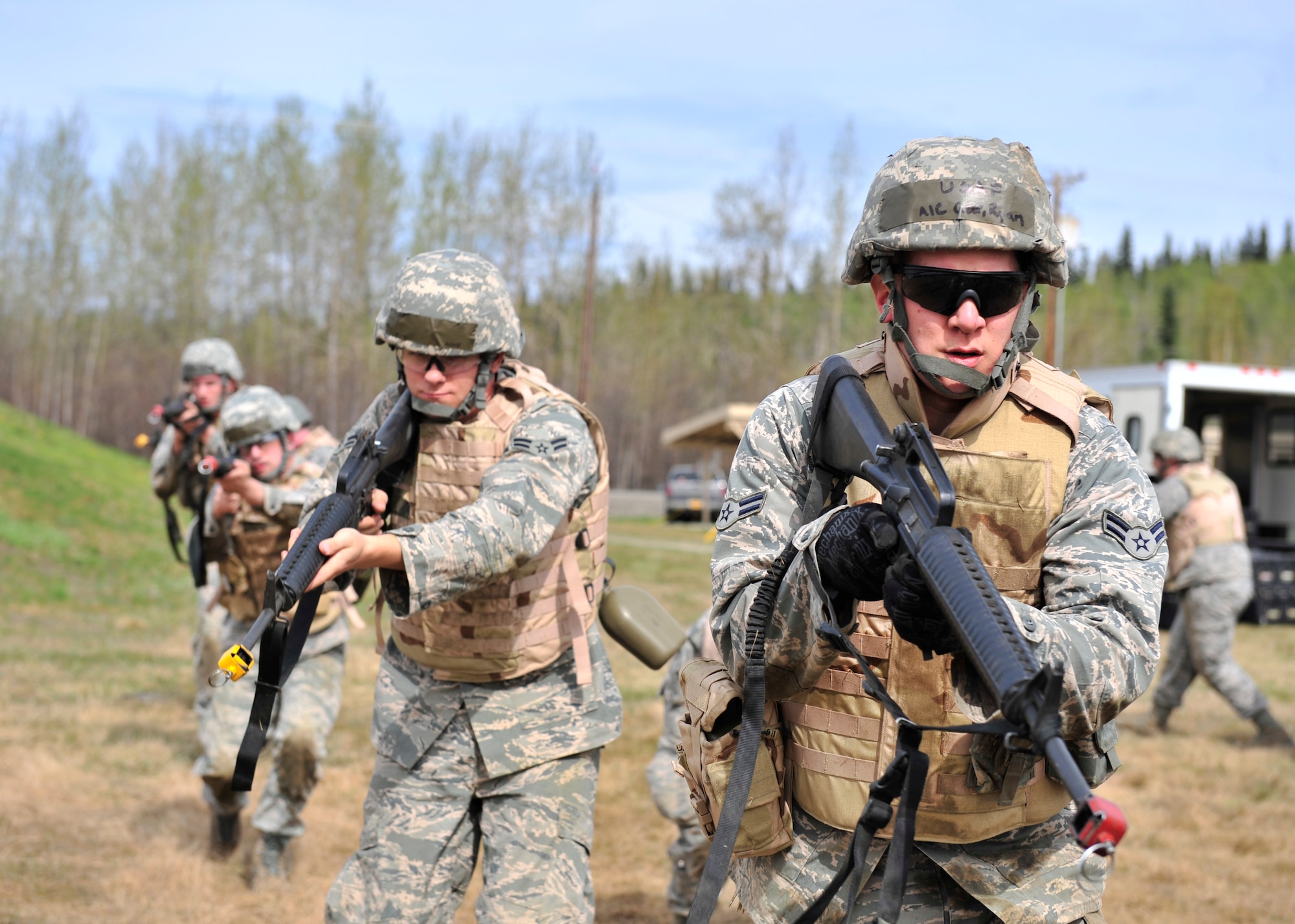 354th Civil Engineer Squadron members practice individual movement training with M-16A2 rifles May 15, 2014, Eielson Air Force Base, Alaska. Engineers were taught different techniques to move quickly while producing the least amount of sound. (U.S. Air Force photo by Senior Airman Ashley Nicole Taylor/Released)