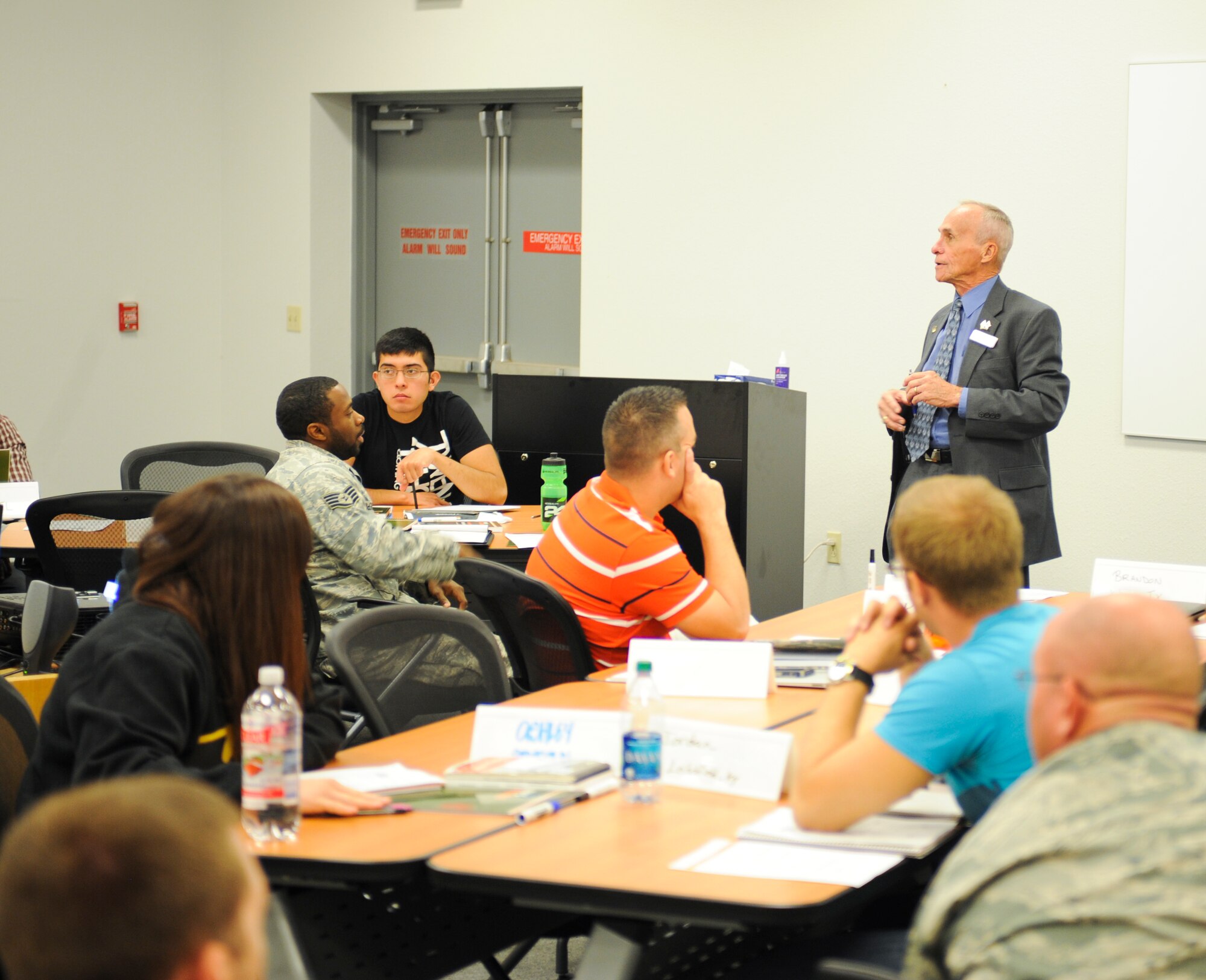 James Hopper, U.S. Small Business Administration Veteran’s Business of Development Officer for Ariz., educates service members and Department of Defense civilian employees about Operation Boots to Business during a transition assistance program seminar at Davis-Monthan Air Force Base, Ariz., May 21, 2014. Operation Boots to Business is an interactive two-day seminar where service members and DoD civilian employees are introduced to business ownership.   (U.S. Air Force photo by Senior Airman Sivan Veazie/Released)
